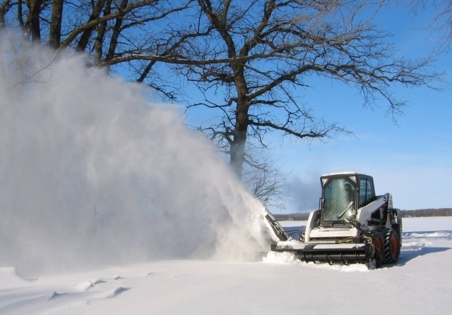 Hydramax Snow Blower throwing snow.